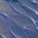 Colorful abstract pattern resembling digital waves with intricate texture in blue and purple hues.