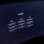 Close-up of a computer screen displaying ChatGPT interface in a dark setting.