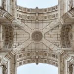 Detailed view of the Arco da Rua Augusta's ornate ceiling in Lisbon, showcasing intricate architecture.