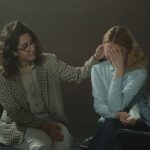 A comforting moment during a support session, highlighting empathy and understanding.