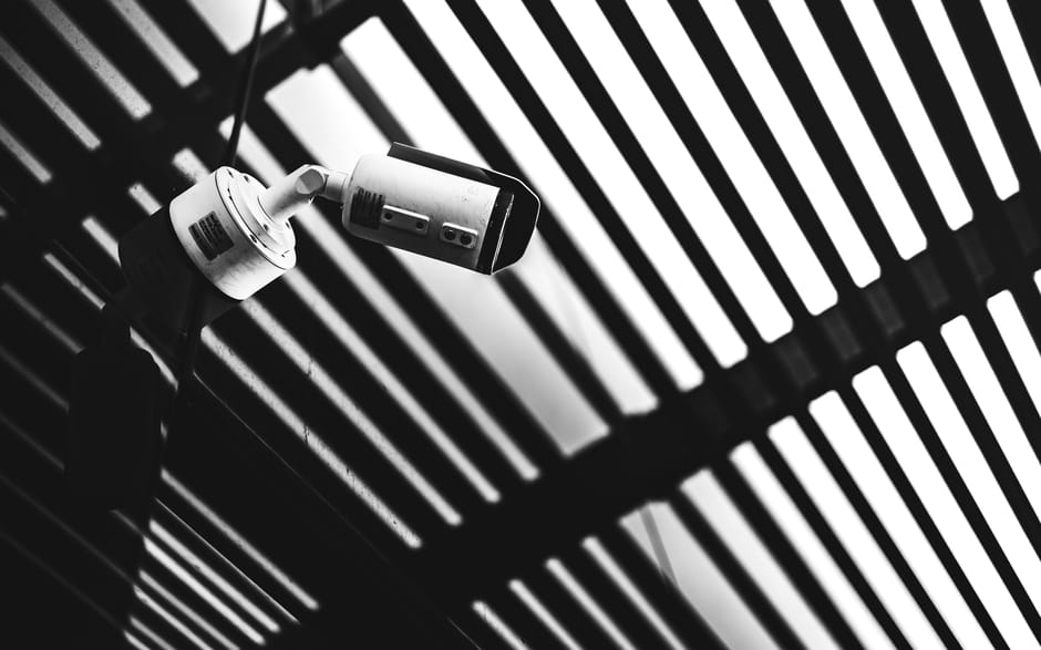 The Panopticon Effect: Surveillance Architecture and Strategic Agency