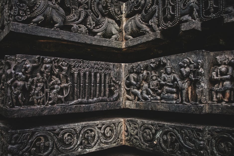 Close-up of ancient stone carvings depicting historical and mythical scenes.