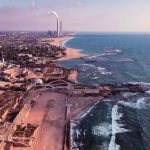 Breathtaking aerial shot of Caesarea's ancient ruins along the Mediterranean coast, Israel.