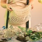 Mesh bag and plastic bottles symbolize recycling and zero waste lifestyle.