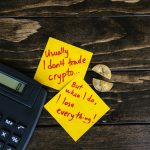 A satirical still life image depicting crypto investment risks with sticky notes, calculator, and broken coin.