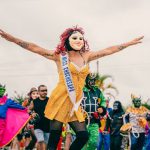 Vibrant carnival with performers in colorful costumes and masks in San Martín, Perú.