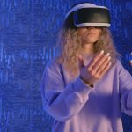 A woman experiencing virtual reality gaming with VR headset in a modern tech setting.